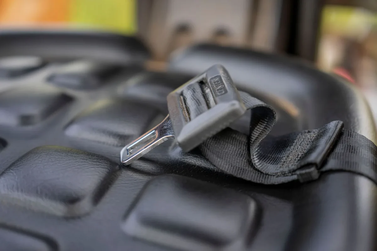 Seat belt interlock switch and connector removed from under a UTV seat
