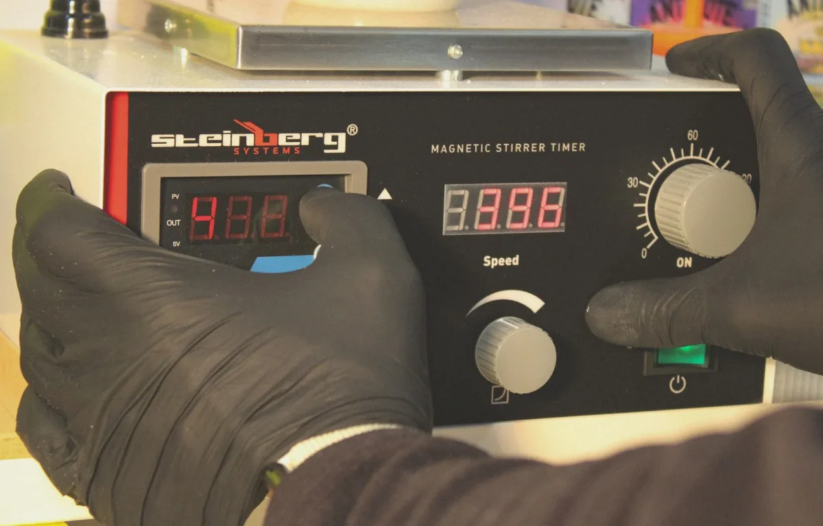Multimeter set to AC volts testing a Honda ATV stator connector