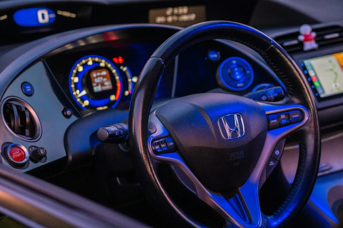 Honda Pioneer dash showing the blinking check engine indicator
