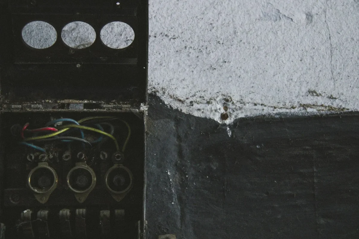 Checking a corroded UTV wiring connector with a multimeter probe