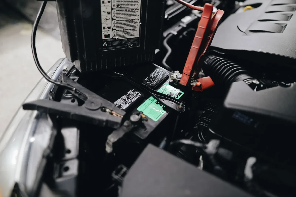 Testing voltage drop at a UTV battery terminal with a digital multimeter